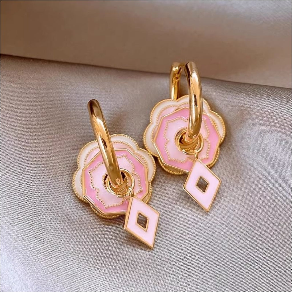 Pink flower earrings with golden glaze