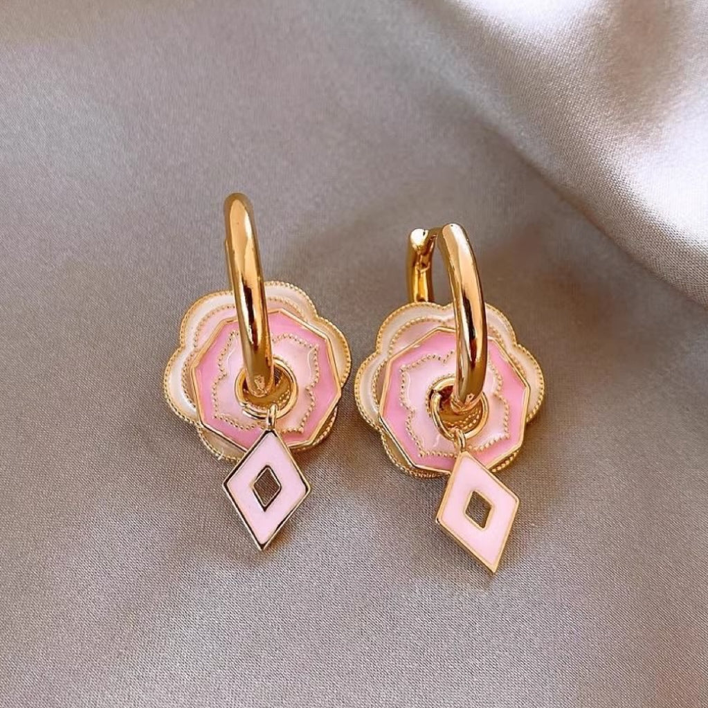Pink flower earrings with golden glaze